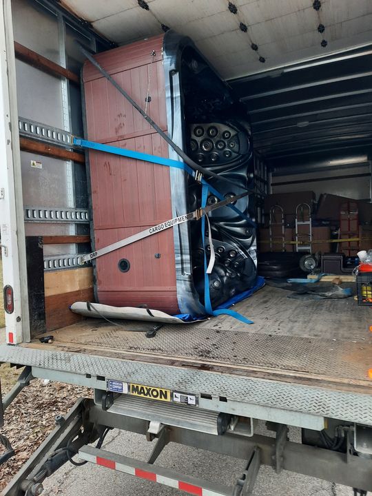 Hot tub strapped upright inside a moving truck (Hot Tub Moving services) by Moving Pros CLE