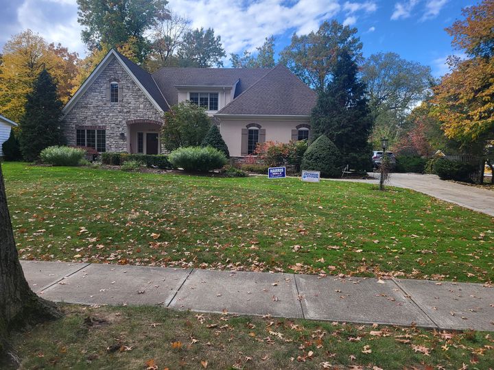 Stone cottage home with a front lawn (Onsite Moving Services) by Moving Pros CLE