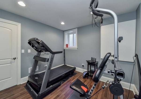 Home gym with treadmill and exercise equipment set up (Pickup and delivery) by Moving Pros CLE
