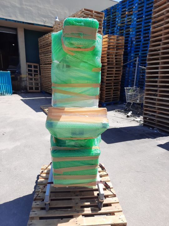 Shrink-wrapped items stacked on a pallet (specialized hauling) by Moving Pros CLE